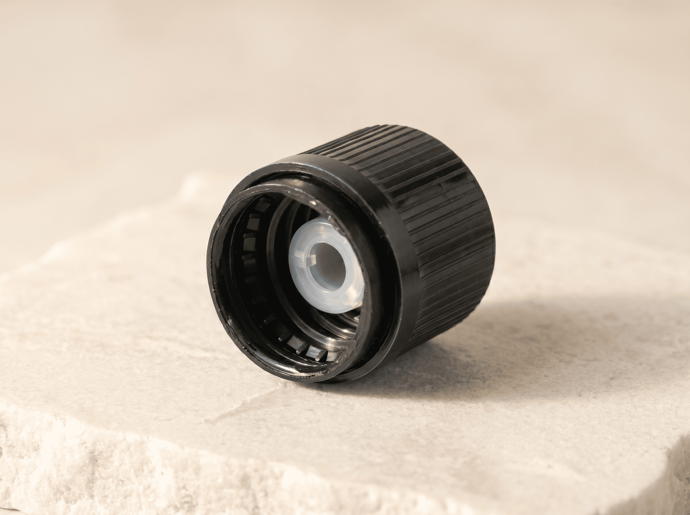 18-415 Black TE/CR Cap with PIBA Stopper Front three-quarter hero white scenery product image