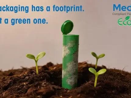 A green, textured packaging tube standing upright in soil, surrounded by small sprouting seedlings. Text reads: 'Your packaging has a footprint. Make it a green one.' accompanied by the MedLock and EcoPure logos.