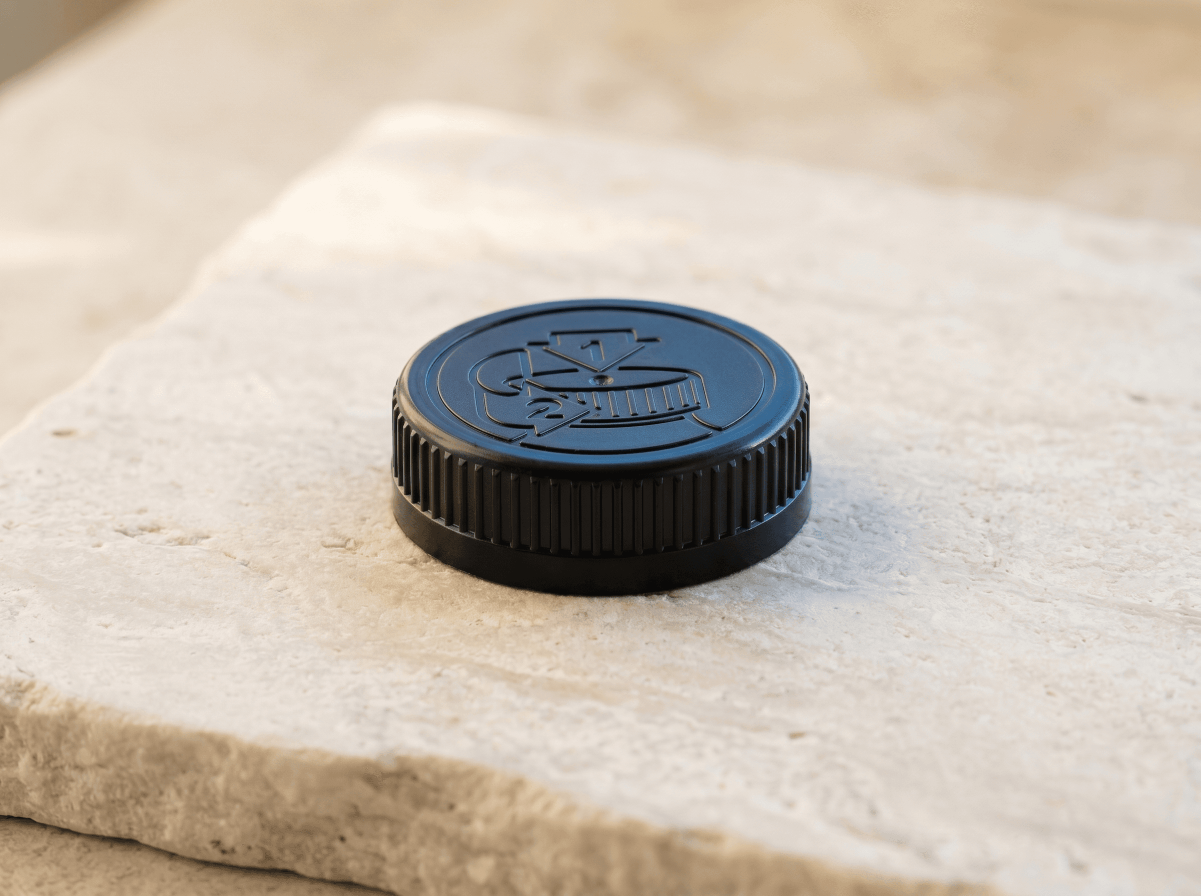 Black 52mm TE/CR Cap Front three-quarter hero white scenery product image