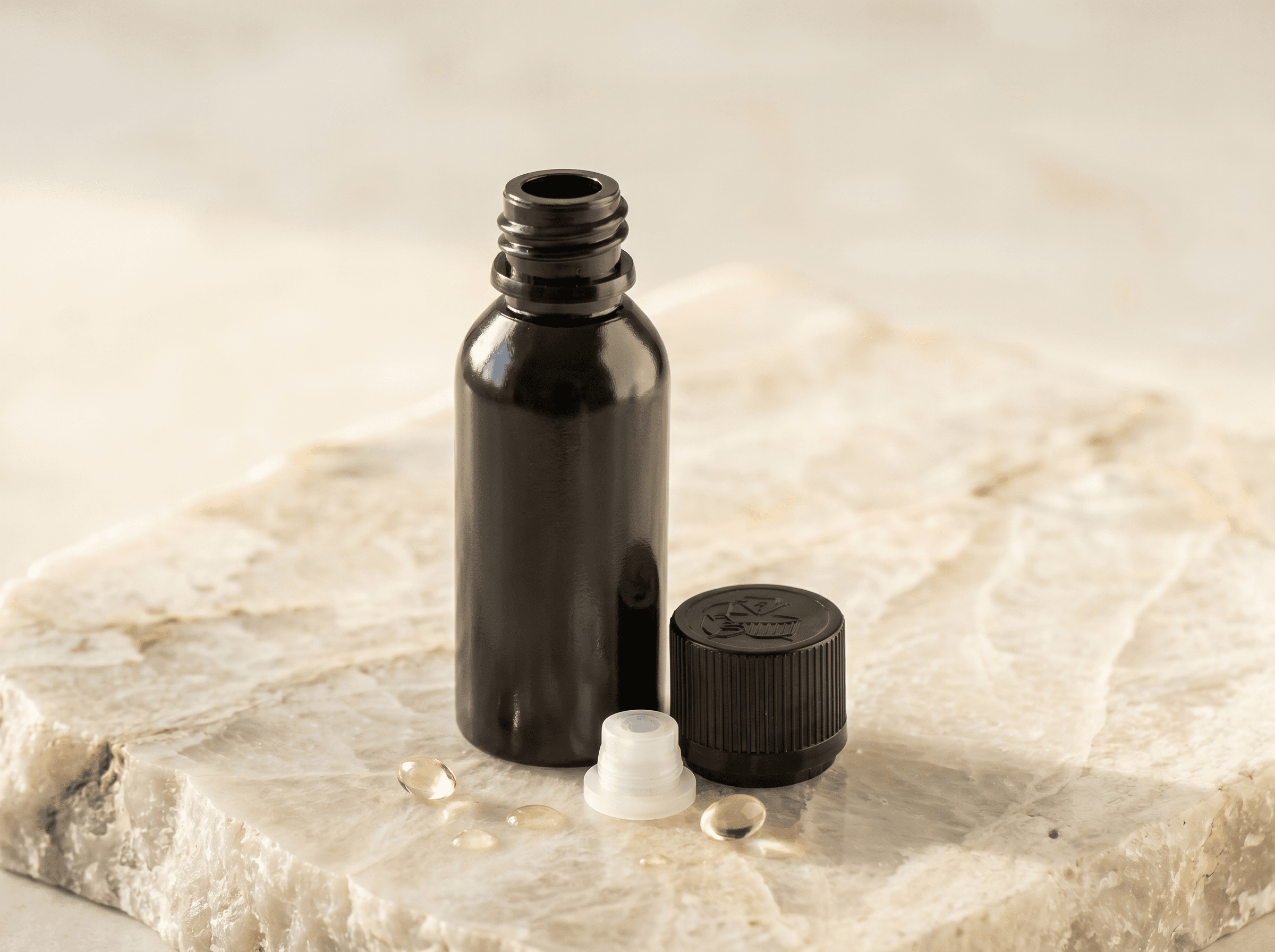 18-415 black plastic bottle 40ml Front three-quarter hero white scenery product image